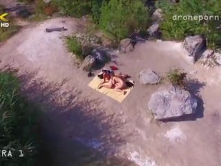 Nude beach sex, voyeurs film taken by a drone