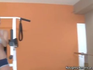 Young brunette has screaming orgasms on weight equipment