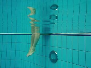 Pleasant teen Deniska swimming naked in the pool